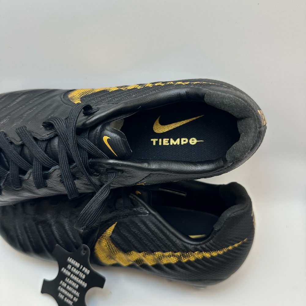 Nike Tiempo Black and Gold Cleats